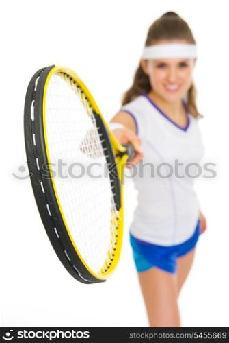 Closeup on tennis racket in hand of woman