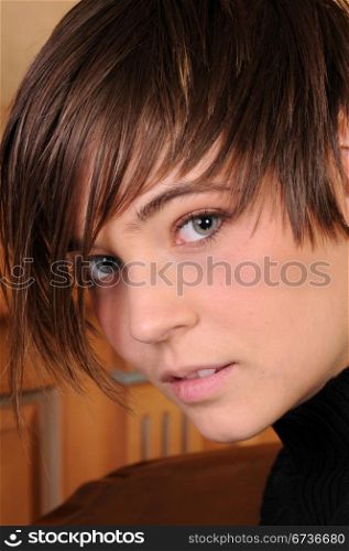 Closeup on the face of a pretty short haired brunette