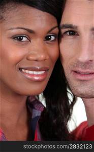 Closeup on the faces of a young couple