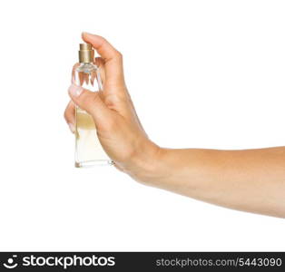 Closeup on woman hand applying perfume