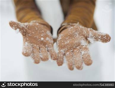 Closeup on woman hand in snowed gloves
