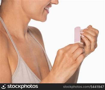 Closeup on woman using nail file