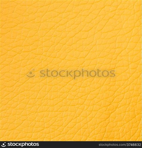 Closeup on yellow leather background.