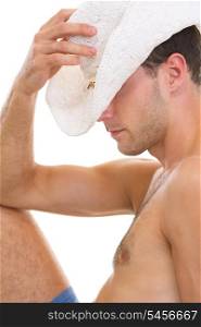 Closeup on young man in hat relaxing on vacation