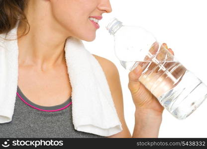 Closeup on young woman drinking water