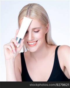 Closeup personable beautiful perfect natural cosmetic makeup skin woman holding mockup tube moisturizer cream for healthy skincare treatment, anti-aging product advertisement in isolated background.. Closeup personable perfect skin woman holding mockup moisturizer tube.