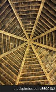 Closeup photo about a wooden roof from below.