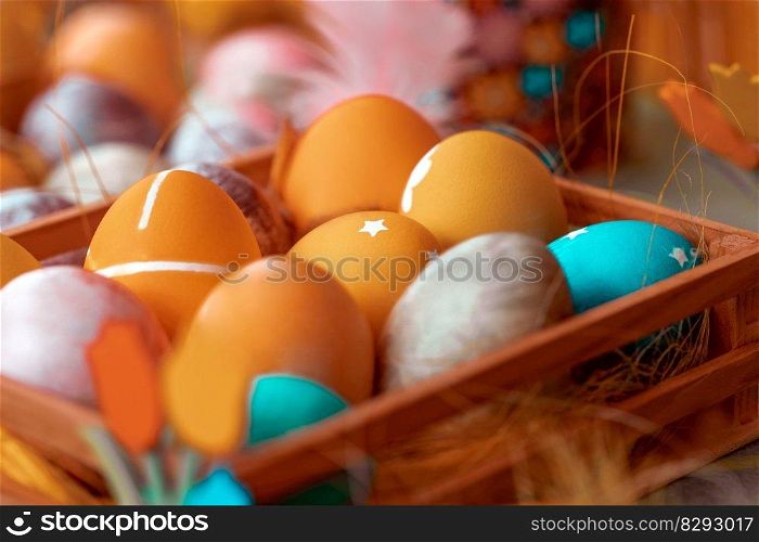 Closeup photo of a beautiful colorful decorated Easter eggs. Traditional symbol of the Christian religious holiday. Festive food still life.. Traditional colorful decorated Easter eggs
