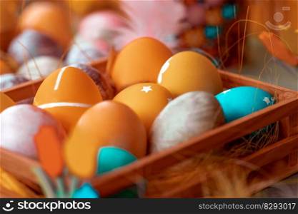 Closeup photo of a beautiful colorful decorated Easter eggs. Traditional symbol of the Christian religious holiday. Festive food still life.. Traditional colorful decorated Easter eggs