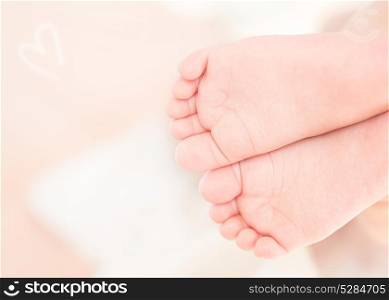 Closeup photo of a cute little baby feet, health care, massage for newborn child, new life concept