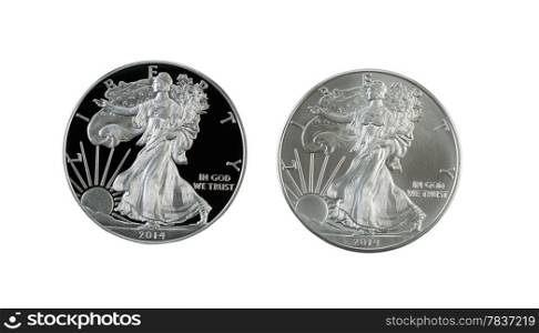 Closeup photo of a proof and uncirculated American Silver Eagle Dollar Coins side by side isolated on white