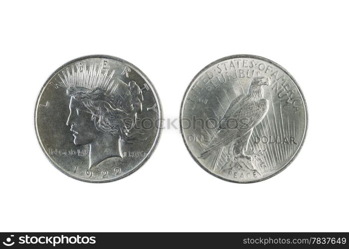 Closeup photo of a Two Peace Silver Dollars, obverse and reverse sides, isolated on white