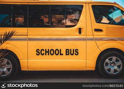 Closeup Photo of a Yellow School Bus. Safe Way to get to School. Traditional Transport for Pupil and Students.. Yellow School Bus