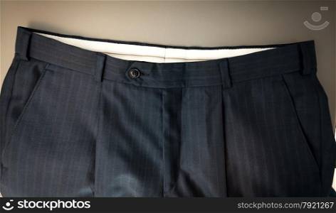 Closeup photo of classic male trousers waist
