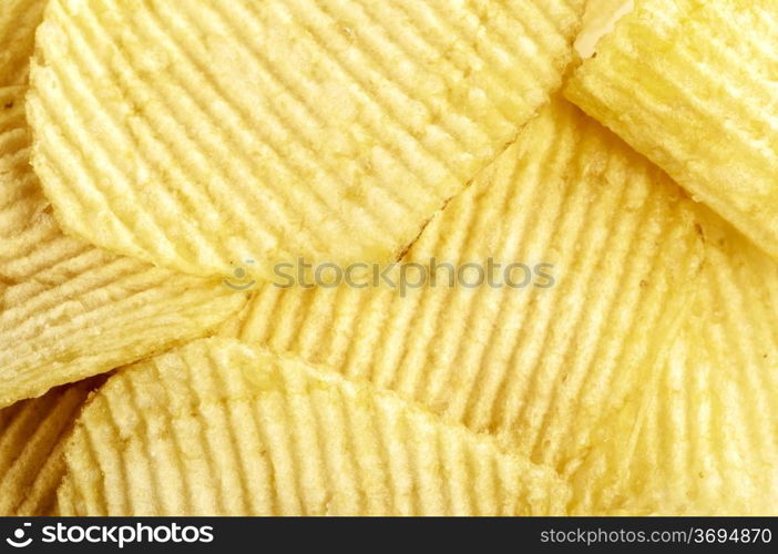 closeup photo of crispy yellow potato crisps