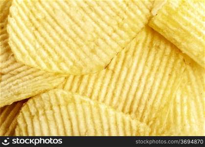closeup photo of crispy yellow potato crisps