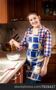 Closeup photo of housewife mixing flour in bowl