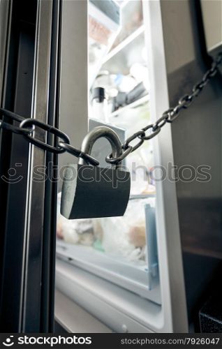 Closeup photo of lock hanging on refrigerator