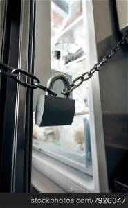 Closeup photo of lock hanging on refrigerator