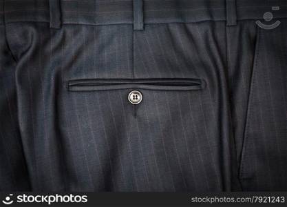 Closeup photo of male classic trousers with back pocket