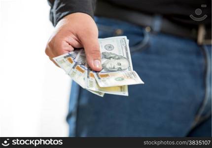 Closeup photo of man showing hand with hundred dollar banknotes