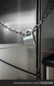Closeup photo of metal chain on fridge