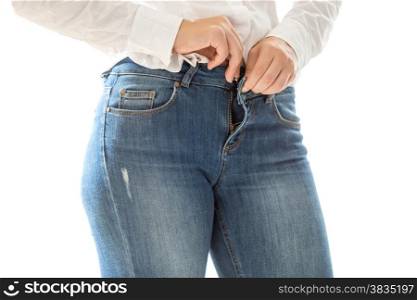 Closeup photo of sexy woman putting on blue jeans