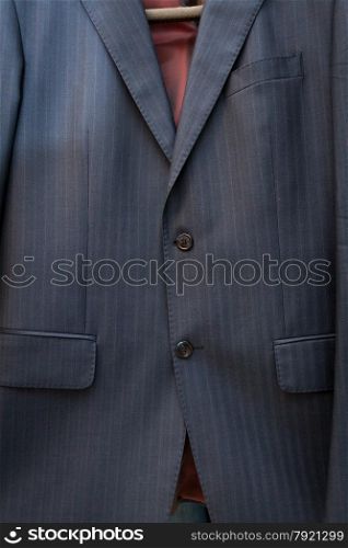 Closeup photo of silk blue jacket with stripes