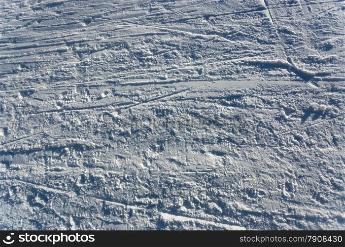 Closeup photo of skis marks on snow slope