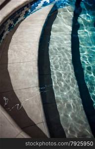 Closeup photo of steps in swimming pool