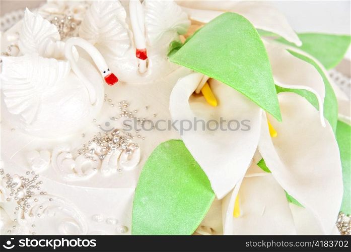 Closeup photo of the wedding cake with swan