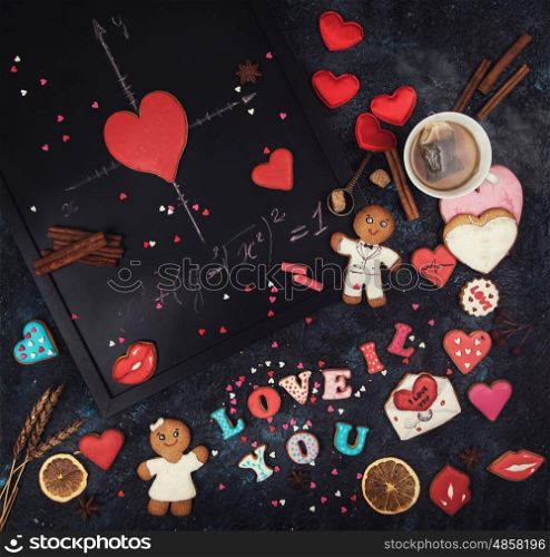 Closeup photo of the woman lips and gingerbread hearts on a stick, concept of love or valentines das