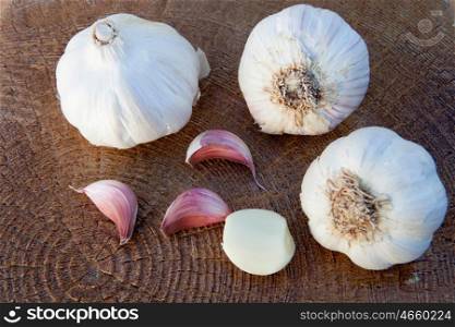 Closeup photo of two large garlic on a wooden background