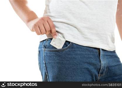 Closeup photo of young man putting condom in jeans pocket