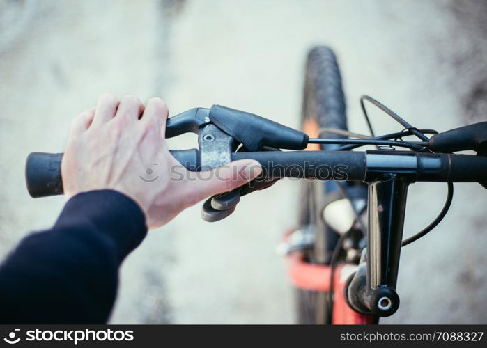 Closeup picture of a bicycle handlebar and breaks, bike repair, blurred background