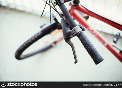Closeup picture of a bicycle handlebar and breaks, bike repair, blurred background