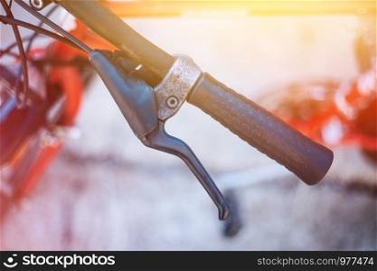 Closeup picture of a bicycle handlebar and breaks, bike repair, blurred background