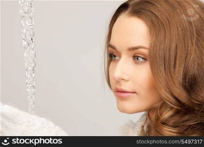 closeup picture of lovely woman with icicle