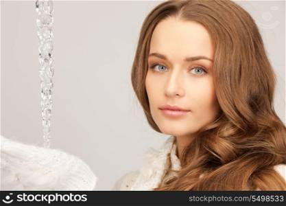 closeup picture of lovely woman with icicle