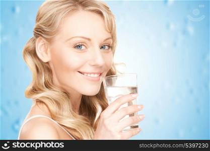 closeup picture of woman hands holding glass of water .