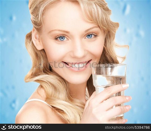 closeup picture of woman holding glass of water .