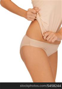 closeup picture of woman in beige cotton undrewear