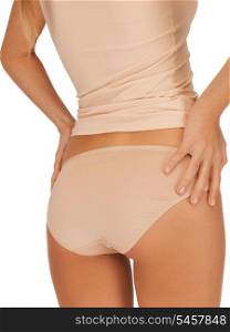 closeup picture of woman in beige cotton undrewear showing slimming concept