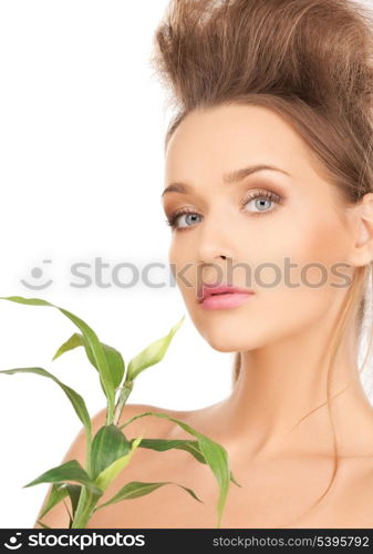 closeup picture of woman with green sprout.