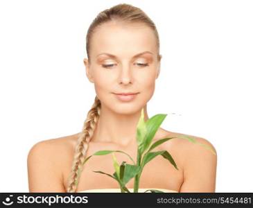 closeup picture of woman with green sprout