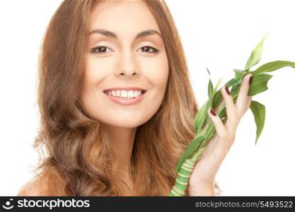 closeup picture of woman with green sprout