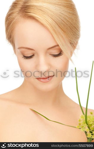 closeup picture of woman with green sprout