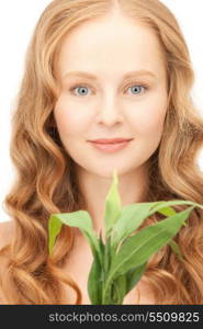 closeup picture of woman with green sprout