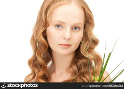 closeup picture of woman with green sprout&#xA;