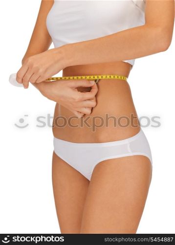 closeup picture of woman with measure tape